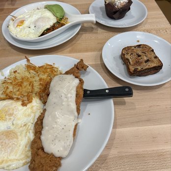 Eggsquisite Cafe - Chicken fried chicken and eggs / raisin bread and blueberry muffin - Breakfast & Brunch Near Me - Fort Worth, Texas