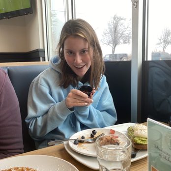 Broken Yolk Cafe - My sister very excited after getting red pepper flakes from our waitress that got them from next door! - Breakfast & Brunch Near Me - Meridian, Idaho