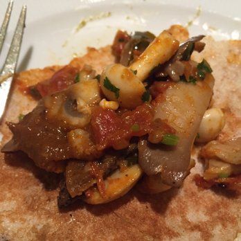 Indian Accent - Dosa filling from inside. 5 diff kind of mushroom filling in tomato-onion gravy. - Indian Near Me - New York, New York Indian Accent - Dosa filling from inside. 5 diff kind of mushroom filling in tomato-onion gravy. - Indian Near Me - New York, New York
