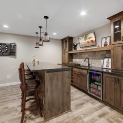 Creations by Caty - This lower level has all custom alder cabinets. Beautiful!