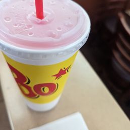 a drink in a plastic cup with a straw a drink in a plastic cup with a straw