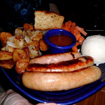 JJ Mahoney's - Bangers and Mash - two grilled Irish sausages with fresh garlic mash, brown sugar carrots, red potatoes and soda bread. - Irish Pub Near Me - Redmond, Washington JJ Mahoney's - Bangers and Mash - two grilled Irish sausages with fresh garlic mash, brown sugar carrots, red potatoes and soda bread. - Irish Pub Near Me - Redmond, Washington