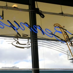Benny's Bistro - Coffee and saxophone signage