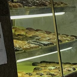 a display case full of donuts a display case full of donuts