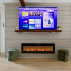 Peyton Home Solutions - Ship lap media wall in the living room.