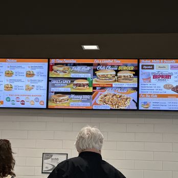 Whataburger - two people standing in front of a menu - Burgers Near Me - Lampasas, Texas Whataburger - two people standing in front of a menu - Burgers Near Me - Lampasas, Texas