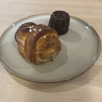 Saint Cecilia - Kanelbullar - Cardamom bun, cinnamon sugar filling.  Campari Canelé - Caramelized crust, doughy and soft interior. - Coffee & Tea Near Me - Victoria, British Columbia