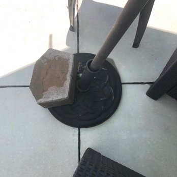 Oak Island Accommodations - The broken umbrella stand that I had to weigh down with a block to keep from it from turning over - Property Management Near Me - Oak Island, North Carolina Oak Island Accommodations - The broken umbrella stand that I had to weigh down with a block to keep from it from turning over - Property Management Near Me - Oak Island, North Carolina