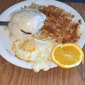 Snooty Fox - Biscuits and gravy with eggs and hash browns. He fully enjoyed it. - Breakfast & Brunch Near Me - Laguna Hills, California