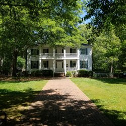 Stately Oaks - House and an old single horse buggy.