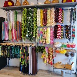 Hula instruments, artificial lei, hats, and pareo
