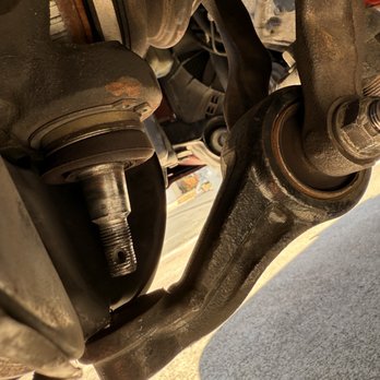 Fremont Alignment - Here is the ball joint and if you zoom in you will see that the nut must have been made out of a harder steel then the ball joint threads. - Auto Repair Near Me - Fremont, California Fremont Alignment - Here is the ball joint and if you zoom in you will see that the nut must have been made out of a harder steel then the ball joint threads. - Auto Repair Near Me - Fremont, California