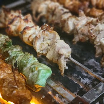 Wow Kebabish - a close up of skewers on a grill - Food Court Near Me - Toronto, Ontario