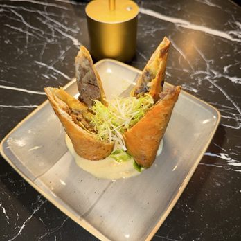 The Cage in Audubon - Cheesesteak eggroll, which is on a horseradish sauce - Cocktail Bars Near Me - Norristown, Pennsylvania