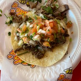 Carne asada tocos.  Large portions of tender, flavorful marinated beef.  Also has pico and cilantro added.   Very good