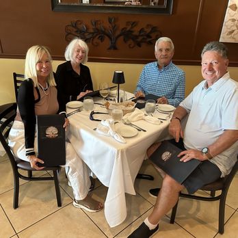 La Perla Di Pompano - White linen tablecloth with soft light ambience - Italian Near Me - Pompano Beach, Florida