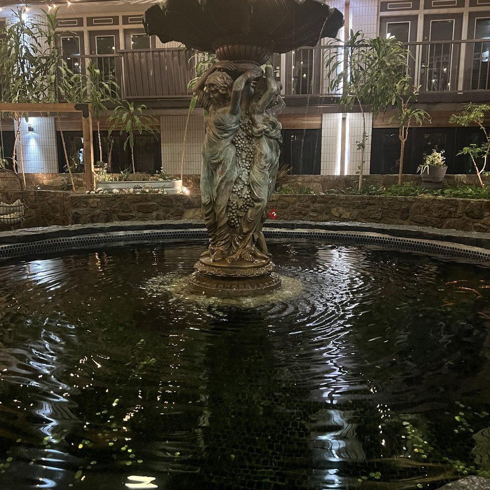 Cactus Cove Inn & Suites - Lobby fountain with koi - Hotels Near Me - Amarillo, Texas