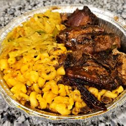 The Scotch Bonnet Kitchen - Jerk chicken with mac and cheese and steamed cabbage