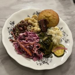 The SIDES SAMPLER with a smidge of beef brisket The SIDES SAMPLER with a smidge of beef brisket