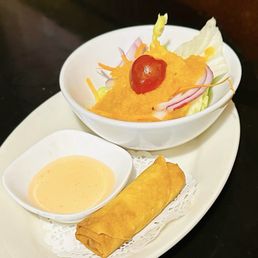 Ginger salad with spring roll