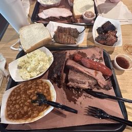 Brisket (fatty and lean), beef sausage, burnt ends, texas twinky, smoked turkey, pork ribs, baked beans.