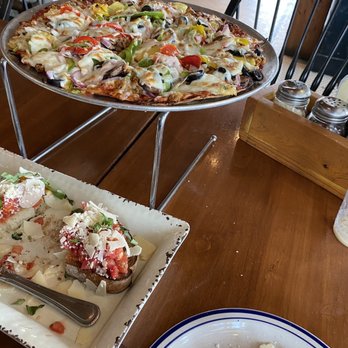 Eno’s Pizza Tavern - Great Seating eating the supreme with pineapple - Pizza Near Me - Dallas, Texas Eno’s Pizza Tavern - Great Seating eating the supreme with pineapple - Pizza Near Me - Dallas, Texas