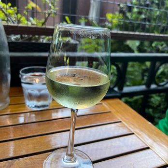 Berkley Bar - a glass of white wine on a wooden table - Cocktail Bars Near Me - Sacramento, California Berkley Bar - a glass of white wine on a wooden table - Cocktail Bars Near Me - Sacramento, California