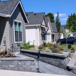 Front yard complete remodel. Raised flower beds and walkway installation.