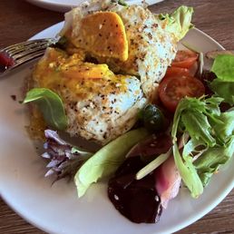 1/2 of the avocado toast with an egg on top 1/2 of the avocado toast with an egg on top
