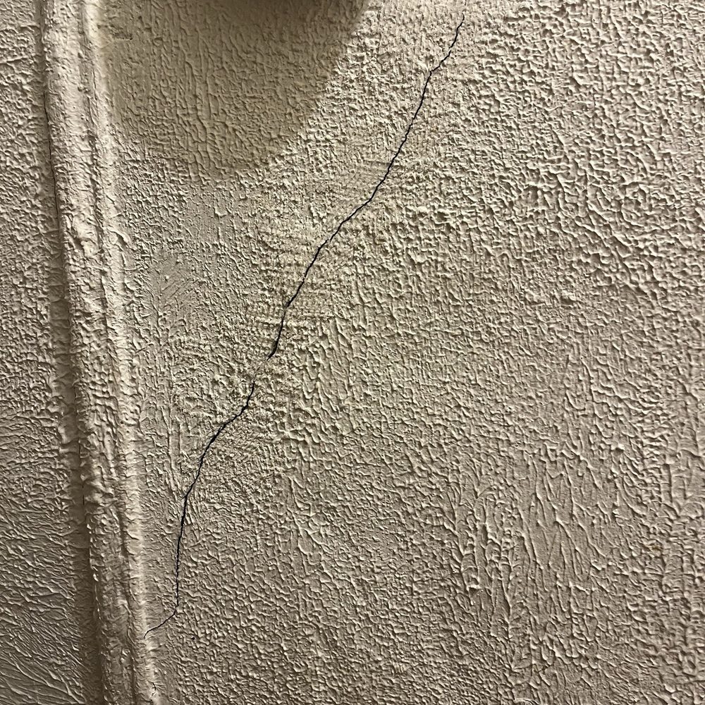 Chelsmore Apartments - Cracked wall in hallway - Apartments Near Me - New York, New York