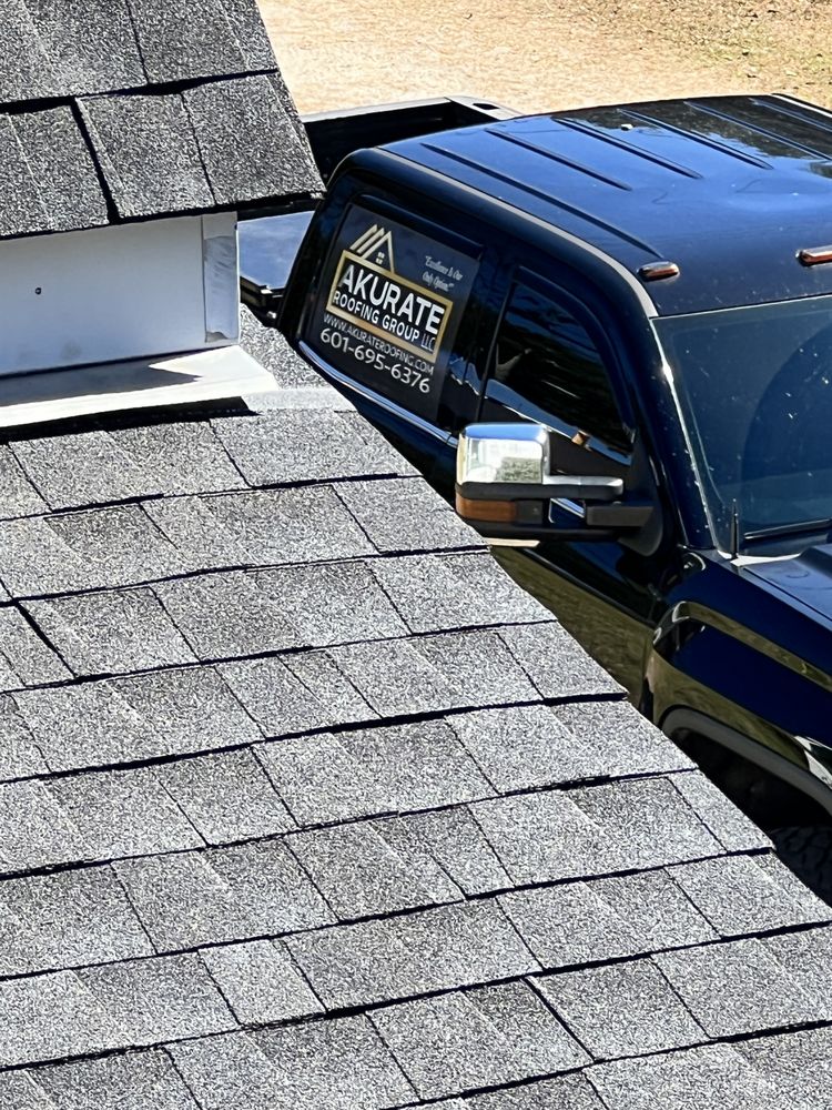 Slide of Akurate Roofing Group