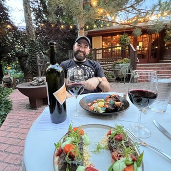 Francks - Outdoor seating which was beautifully set up. The waygu is on my side and the lamb shank is on his. - New American Near Me - Holladay, Utah Francks - Outdoor seating which was beautifully set up. The waygu is on my side and the lamb shank is on his. - New American Near Me - Holladay, Utah