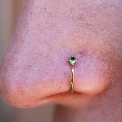 HTC Studios - Tempe - Nostril piercing with a cute green gemmed nose ring.