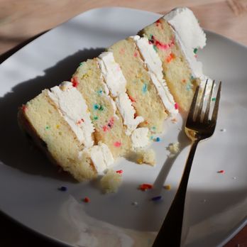 Sienna Cakery - a slice of cake on a plate with a fork - Bakeries Near Me - Hartford, Connecticut Sienna Cakery - a slice of cake on a plate with a fork - Bakeries Near Me - Hartford, Connecticut