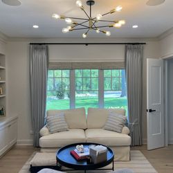 Blinded By The Light Blinds And Shades - Pinch Pleated Room Darkening Drapery with Hunter Douglas Woven Wood Shades.