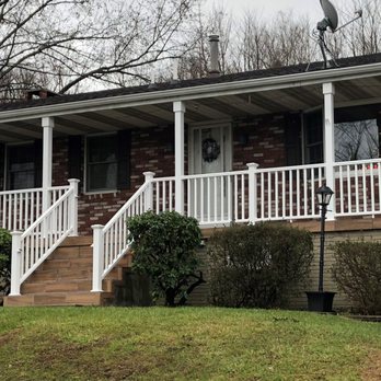QA General Contracting Co. - Peg P.'s Project: Front Porch Remodel - Leveled Porch, Installed Wood-Tiling, and Warp-around Banisters. - General Contractors Near Me