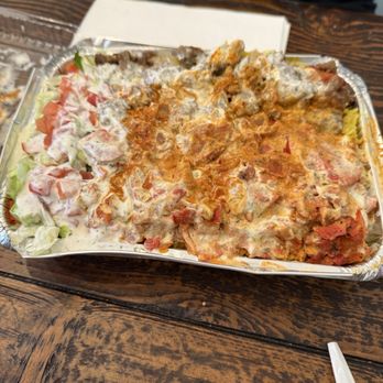 Crown Chicken And Grill - Halal plate with chicken and gyro meat over rice with white and red sauce. - American Near Me - Lancaster, California Crown Chicken And Grill - Halal plate with chicken and gyro meat over rice with white and red sauce. - American Near Me - Lancaster, California