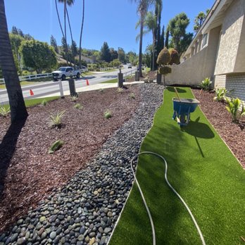 Gold Coast Landscaping - a landscaped area with artificial grass and gravel - Landscaping Near Me Gold Coast Landscaping - a landscaped area with artificial grass and gravel - Landscaping Near Me