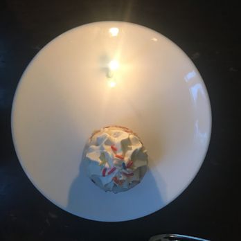 Agustin Kitchen - the birthday cake , actually its more like a cup cake and they do bring a candle - New American Near Me - Tucson, Arizona