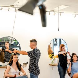 Blast Blowdry - Hair stylists at Blast blow dry in Austin, Texas blowing out hair.