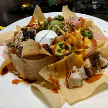 Local Goat - BBQ Chicken Nachos: Sliced chicken, melted cheeses, pickled red onion, cilantro, jalapenos, house BBQ sauce, guacamole, sour cream - New American Near Me - Pigeon Forge, Tennessee