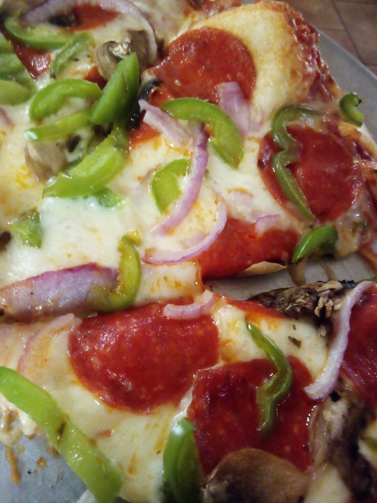 The Whistle Stop Pizzeria & More Logo