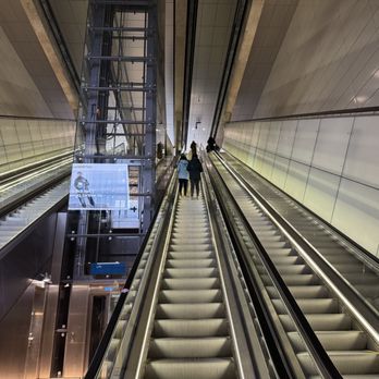Metrostation Rokin - A long set of escalators heading up and down - Metro Stations Near Me