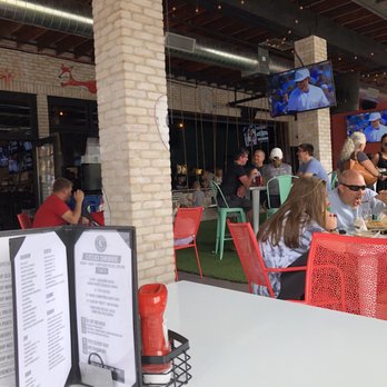 Flagship on the Fox - Corner patio table looking in on the swings, great for kids. - American Near Me - St. Charles, Illinois Flagship on the Fox - Corner patio table looking in on the swings, great for kids. - American Near Me - St. Charles, Illinois