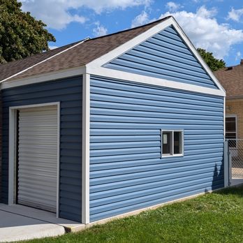 Morpho Carpentry - Garage addition with roll-up doors, custom built to house ride-on mower and electronic kids" vehicles. - General Contractors Near Me Morpho Carpentry - Garage addition with roll-up doors, custom built to house ride-on mower and electronic kids" vehicles. - General Contractors Near Me