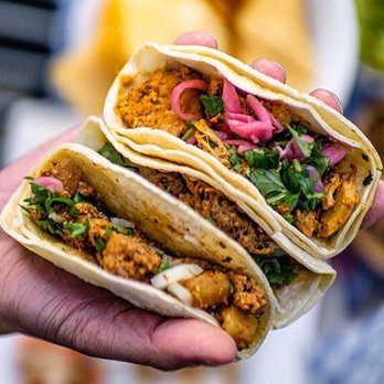 Loz Takos - a hand holding a tortilla - Mexican Near Me - Abbotsford, British Columbia Loz Takos - a hand holding a tortilla - Mexican Near Me - Abbotsford, British Columbia