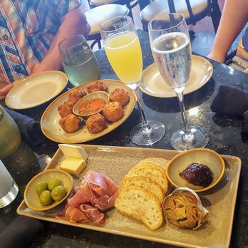 Curio Bistro - Grit tots and charcuterie board. Champaign - Cajun/Creole Near Me - New Orleans, Louisiana Curio Bistro - Grit tots and charcuterie board. Champaign - Cajun/Creole Near Me - New Orleans, Louisiana