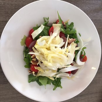 Cafe Epicure - Insalata Caprina - Boston lettuce, arugola, goat cheese, endive, walnuts and olives. (+ tomatoes) - Italian Near Me - Sarasota, Florida Cafe Epicure - Insalata Caprina - Boston lettuce, arugola, goat cheese, endive, walnuts and olives. (+ tomatoes) - Italian Near Me - Sarasota, Florida