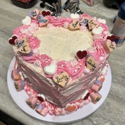 Supernatural Sweets - Red velvet two layer cake with a raspberry cream cheese filling, frosted with a cream cheese buttercream and with homemade chocolate hearts