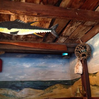 Moby Dick's - The hanging fish and the wall painting makes the atmosphere great. - Seafood Near Me - Wellfleet, Massachusetts